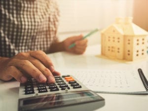 man using calculator